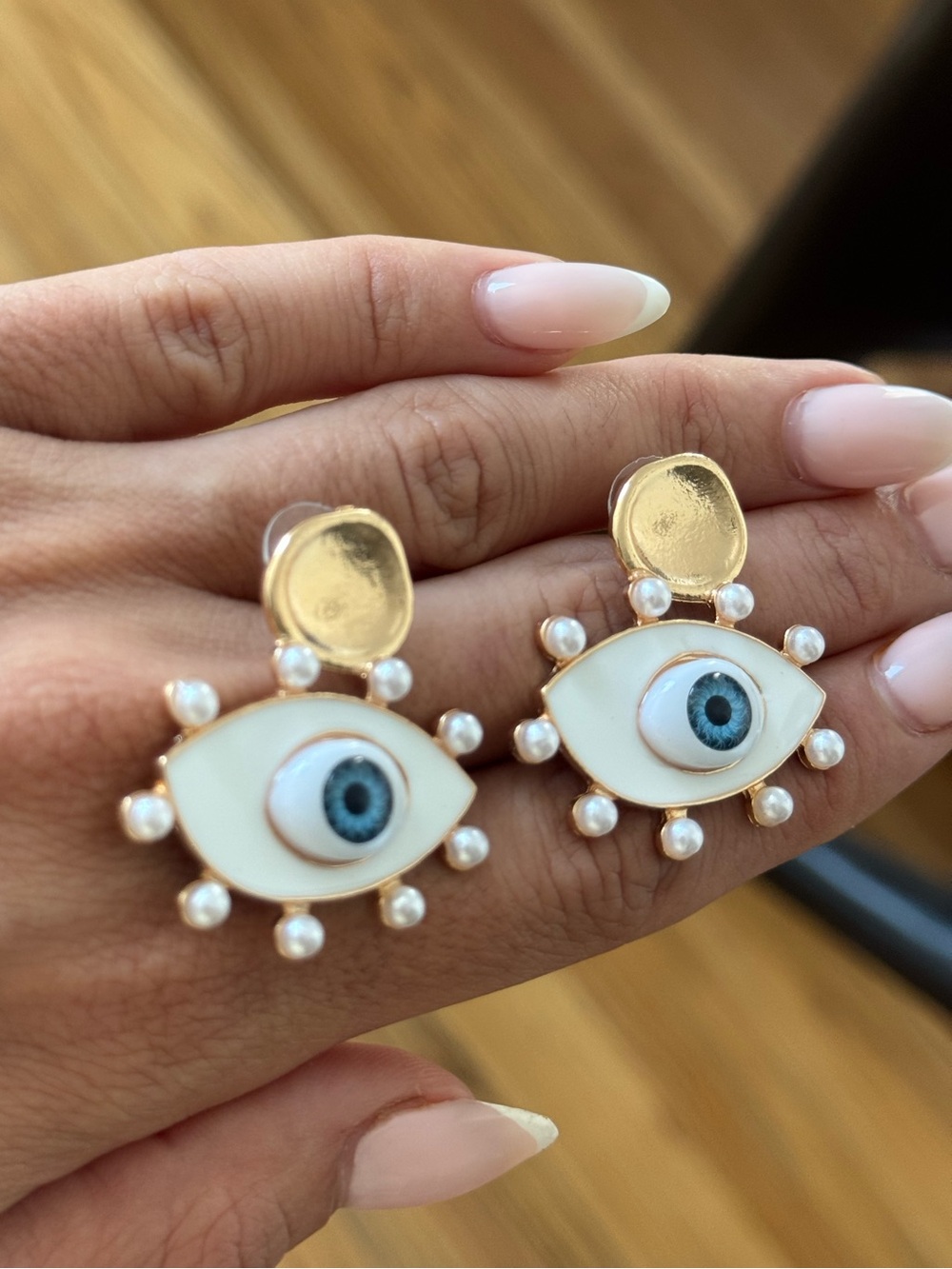 REVOLVE Gold-Tone White Eye Earrings with Blue Center and Pearls